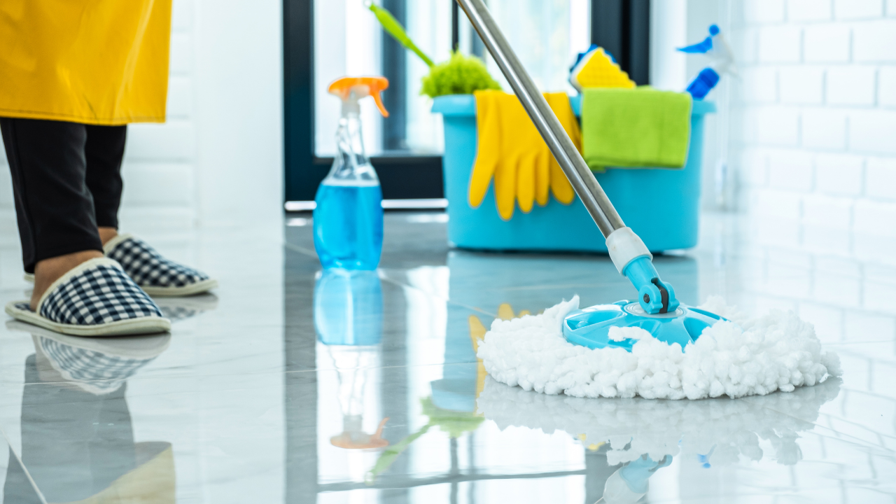 Commercial office cleaning team wiping down desks and surfaces